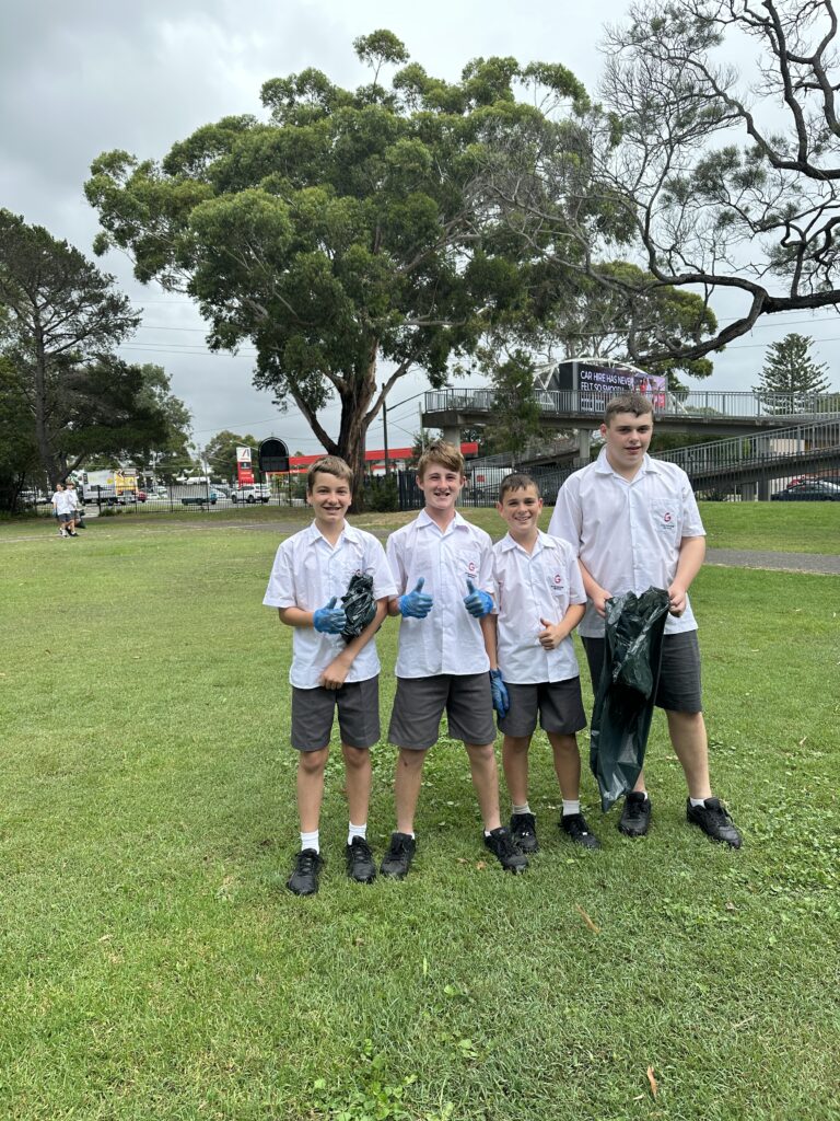 4 Boys collecting rubbish