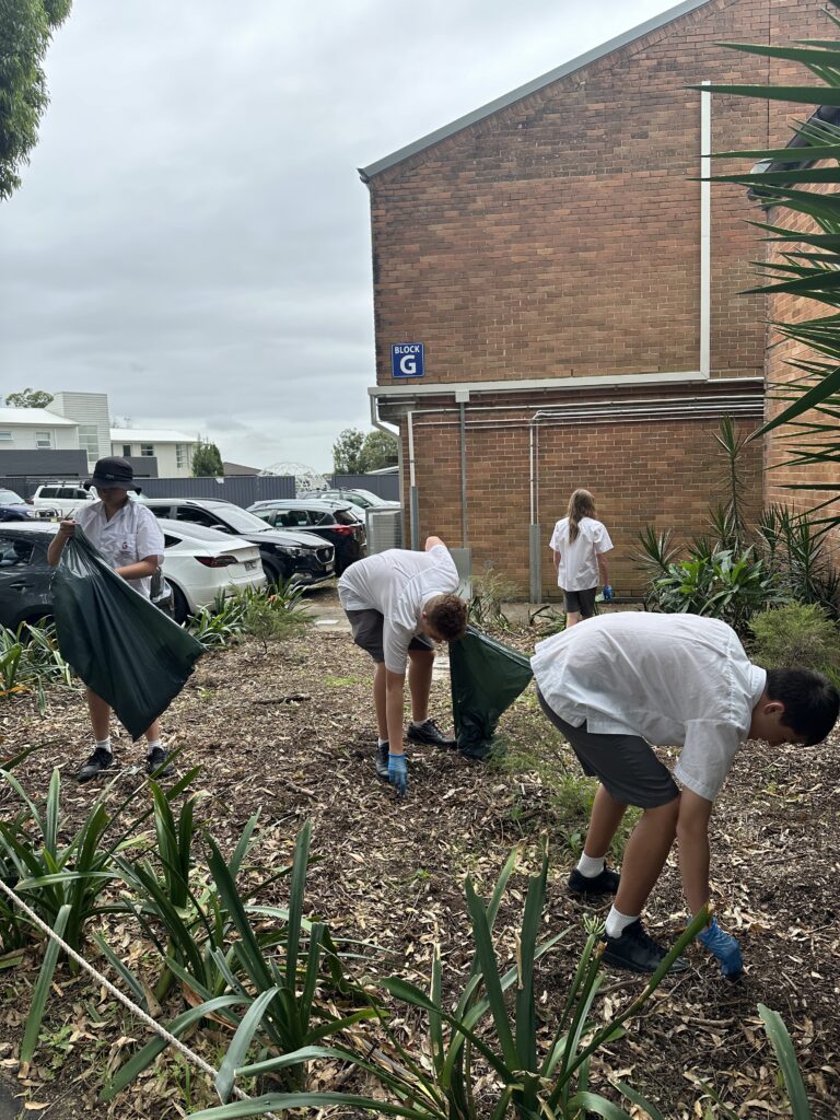 Picking up Rubbish in Garden