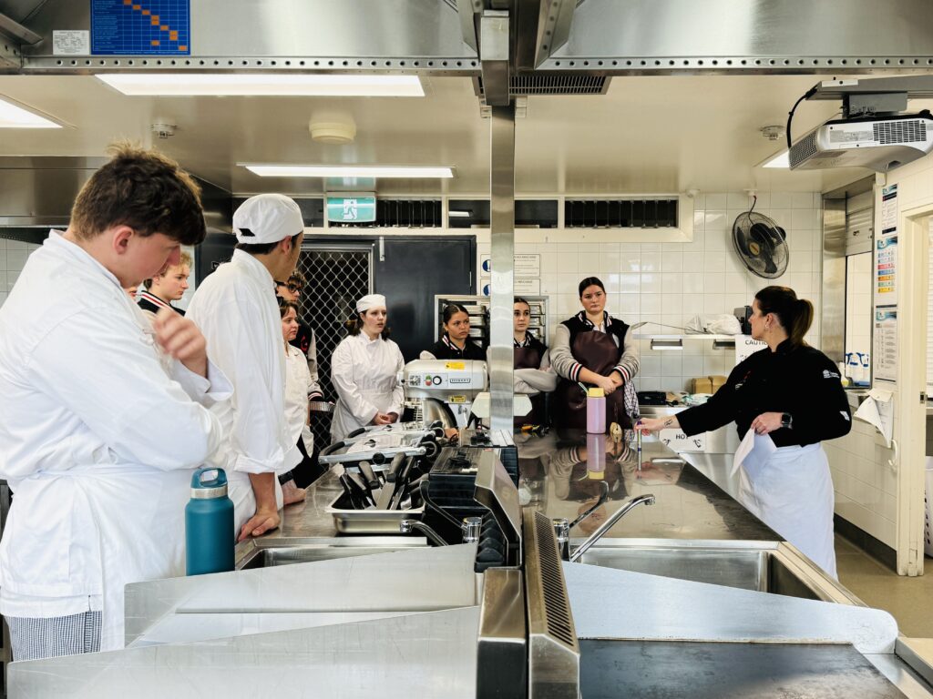Mrs Kimber expertly teach year 11 Hospitality students through techniques.