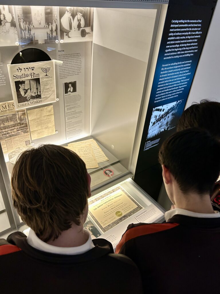 Students examining Holocaust artefacts.