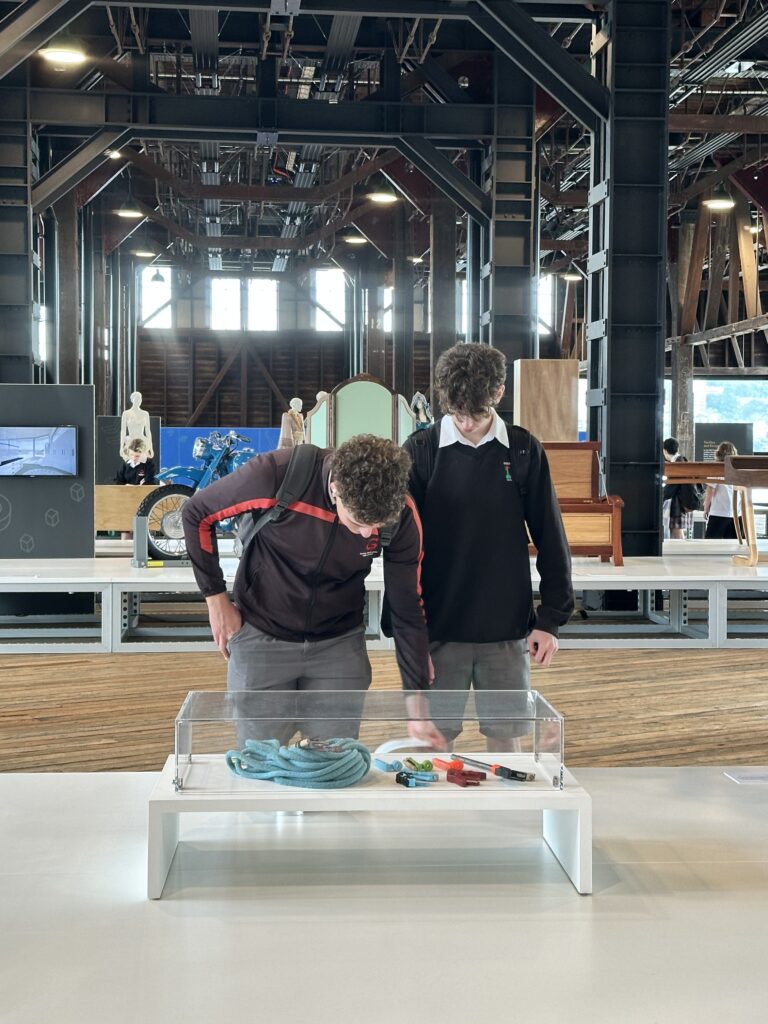 Students examining an interesting HS project very closely.