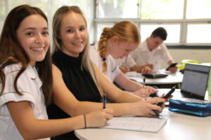 Teacher with students in Mathematics