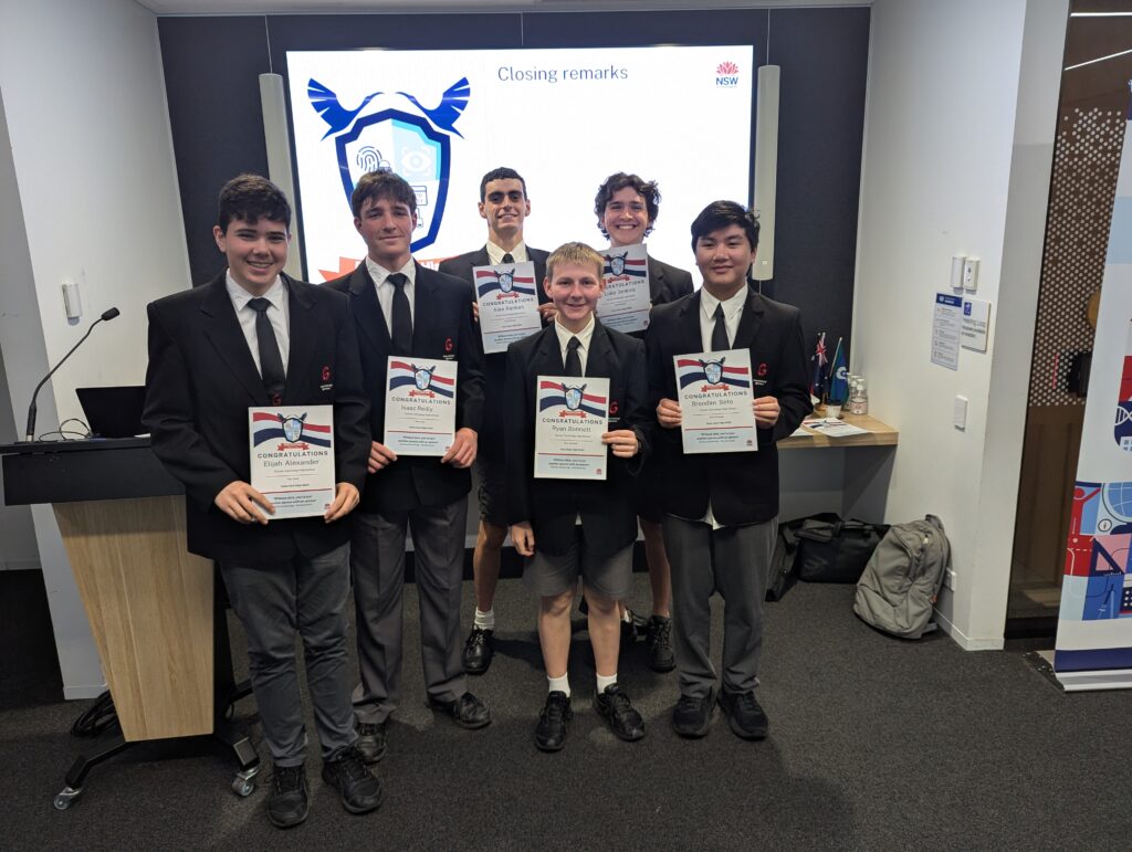 Students proudly show off certificates after outstanding GovHack High success.