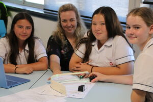 Young STEMSpire designers use lasers to uncover how curves and shapes reflect sound