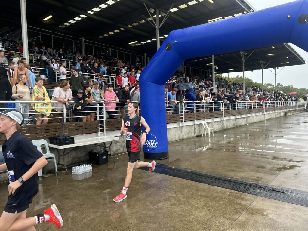 Finn D finishing team tri run leg