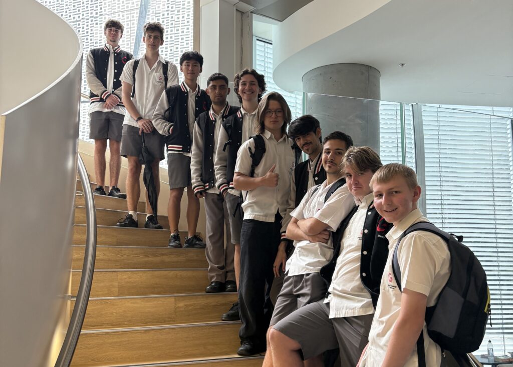 Our excursion group smiling on the double helix staircase at UTS 1