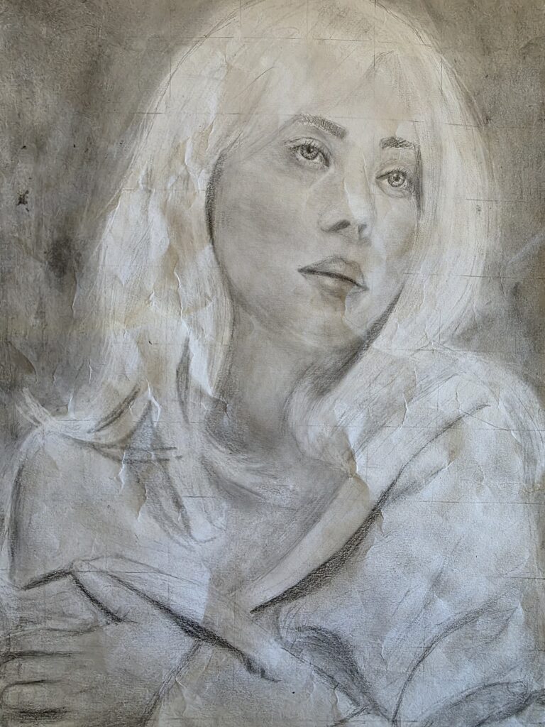Students experiment with graphite pencils, exploring various drawing techniques to render highlights and shadows on faces