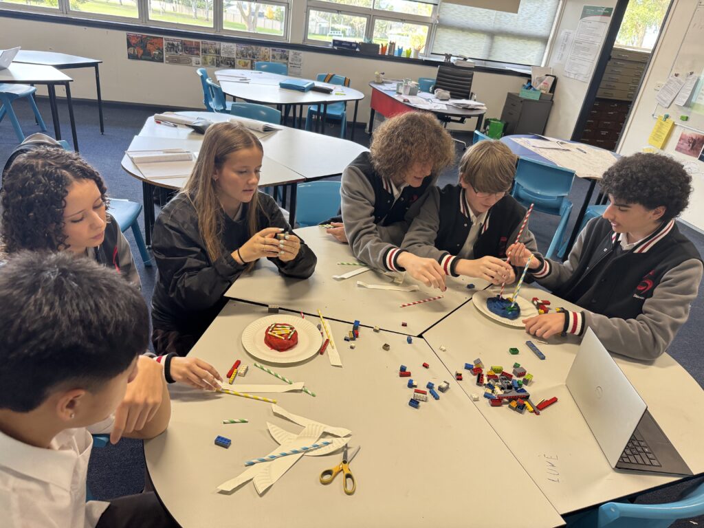 Students collaborated confidently, engineering innovative structures through teamwork, creativity, and real-world geographical problem-solving.