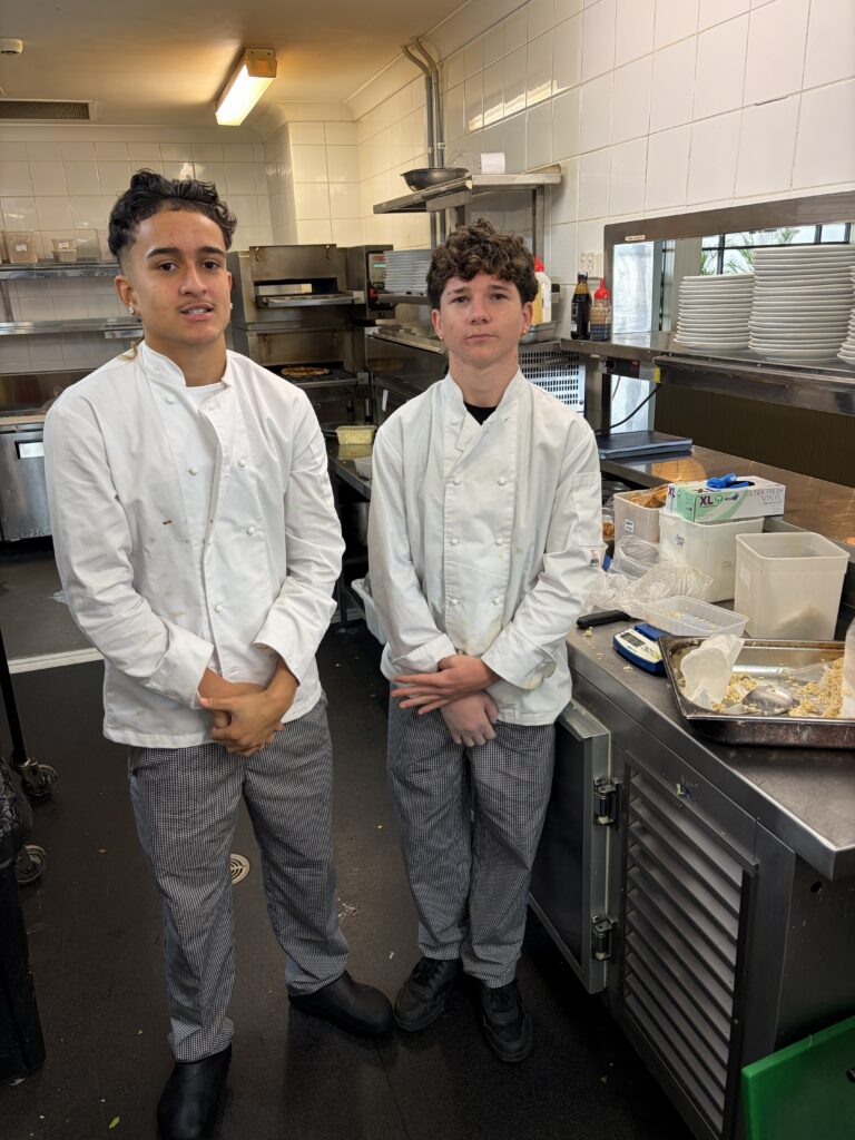 Collaborating professionally, these students demonstrate teamwork, commitment, and outstanding kitchen performance.