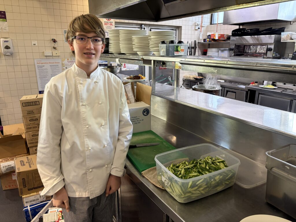 Developing workplace-ready skills, this student demonstrates precision, responsibility, and culinary excellence.