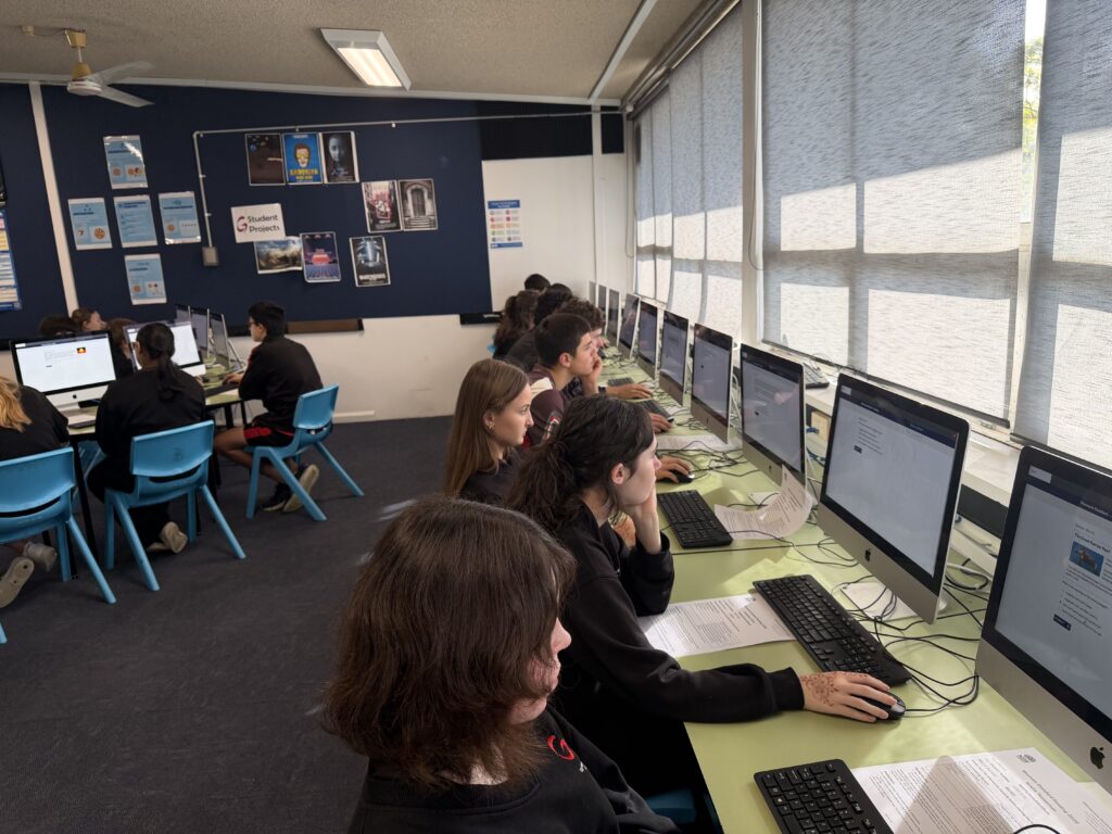 Focused learners engaging with real-world problem-solving and showcasing strong academic progress.