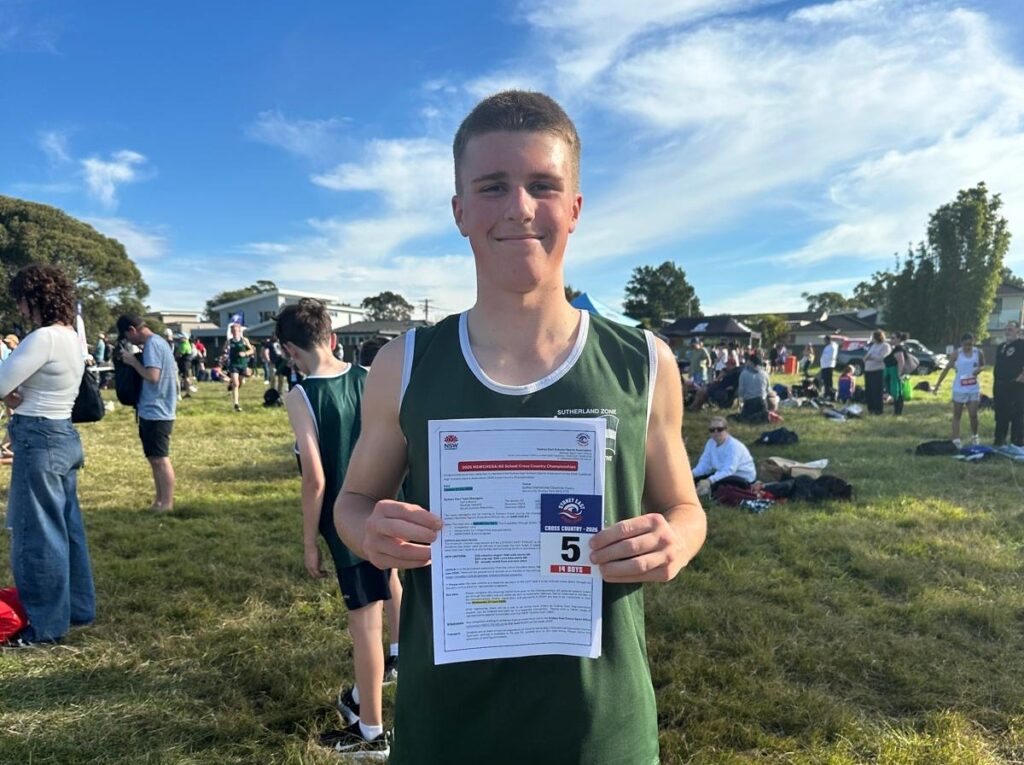 Isaak W proudly holding his 5th placegetter card, next up State Champs!