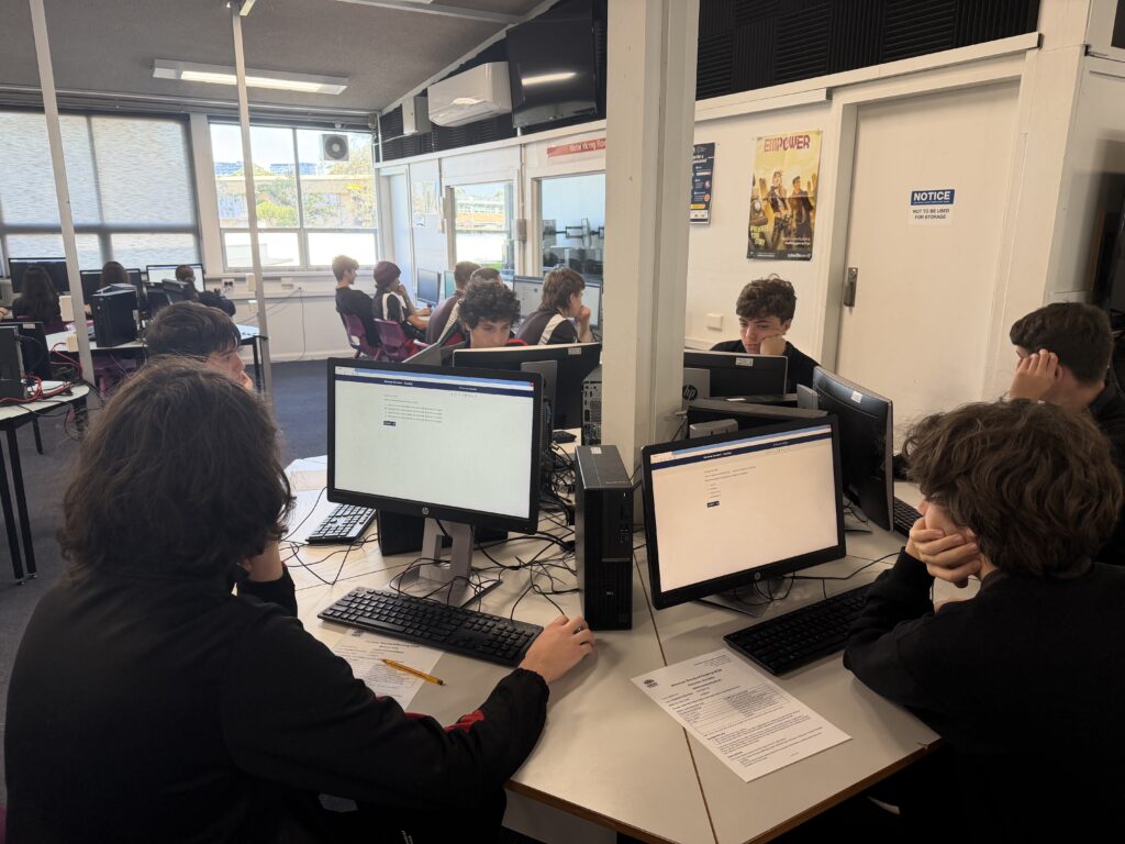 Students demonstrating focus and resilience while building literacy and numeracy success.