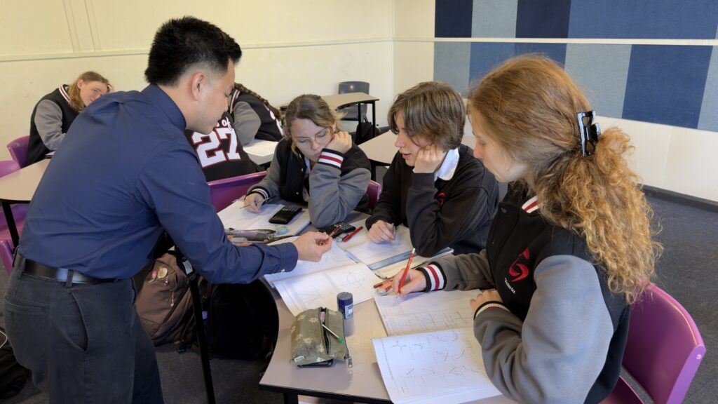 Working together, students apply mathematical reasoning to solve challenging curriculum-based problems